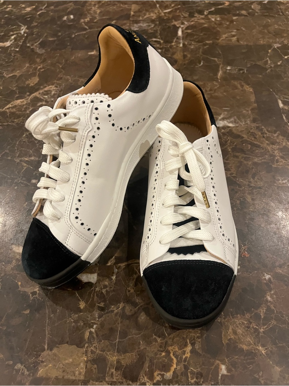 The Office of Angela Scott White and Black Leather Sneakers